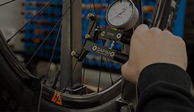 measuring-spoke-tension-with-sapim-tool.jpeg