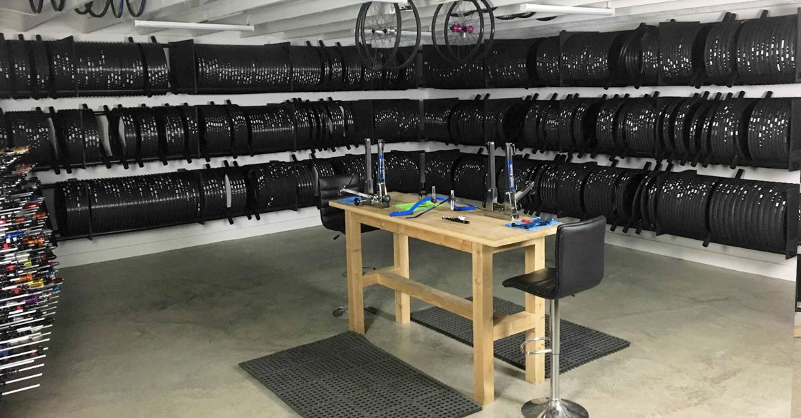 wheel-building-workshop-with-large-quantity-of-carbon-fiber-road-mtb-rims-and-bike-hubs-in-stock.jpeg