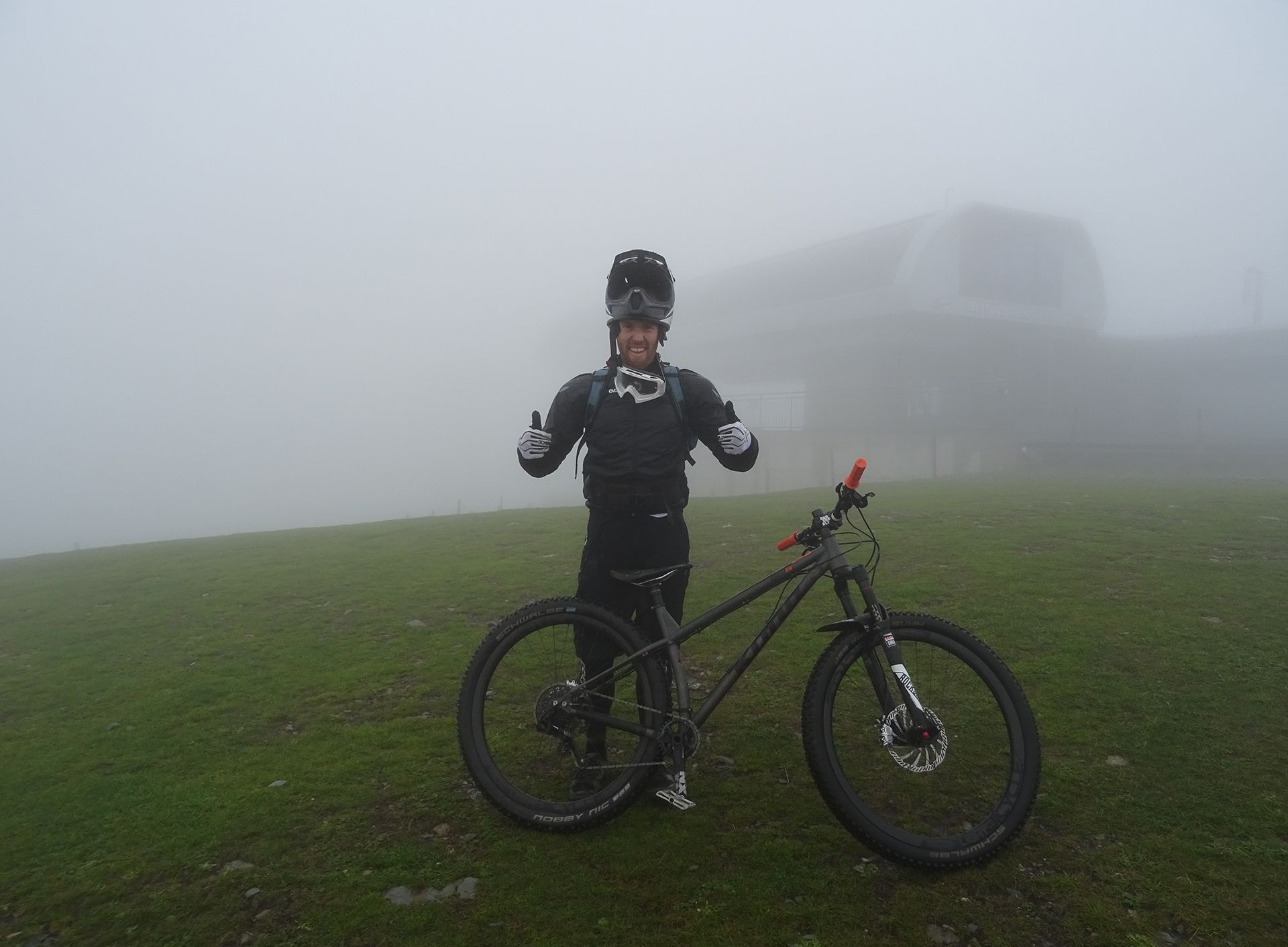 technical-mountain-biker-thumbs-up-in-mist