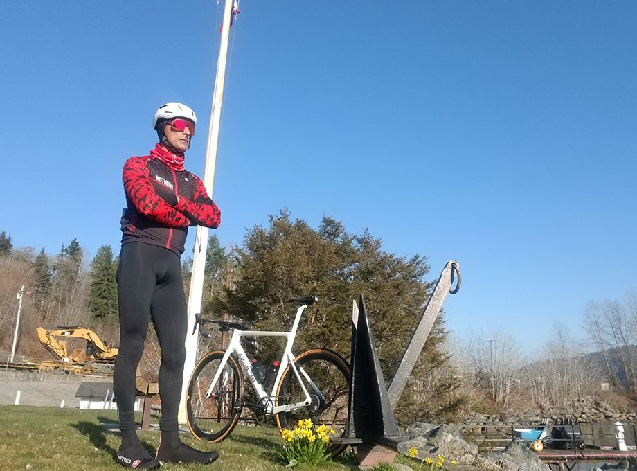 road-rider-standing-by-his-white-lightcarbon-road-bike.jpeg