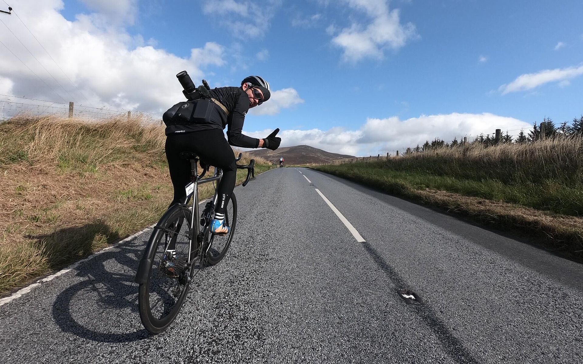 road-cyclist-gives-the-thumbs-up